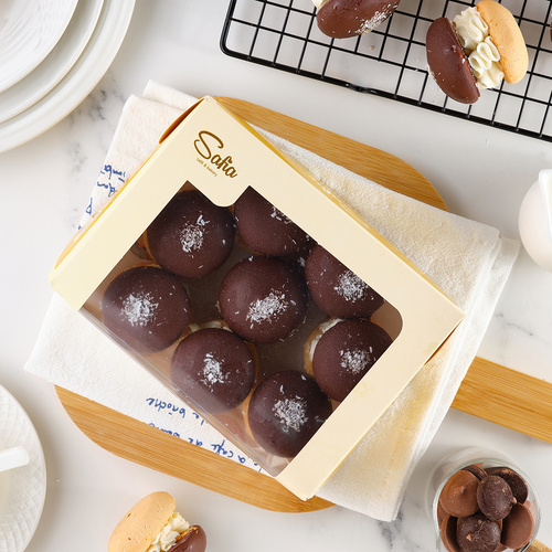 Bushe with black chocolate in mini packaging